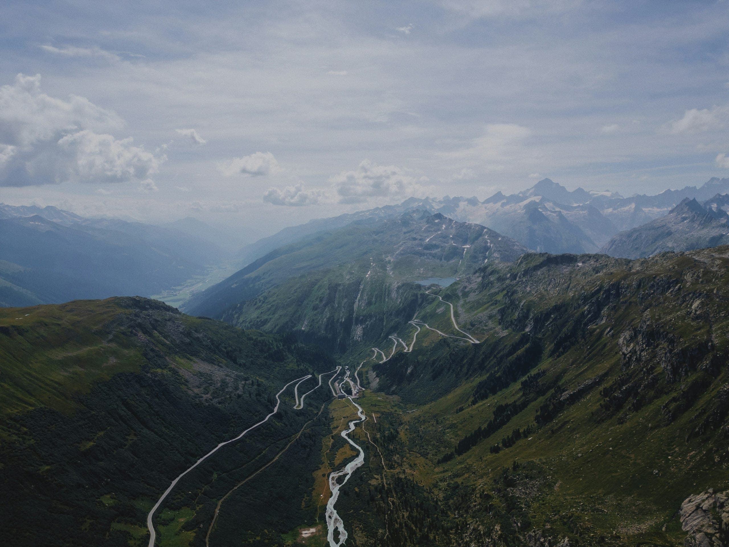 The Grimsel and Furka pass roads winding up the valley from Gletsch