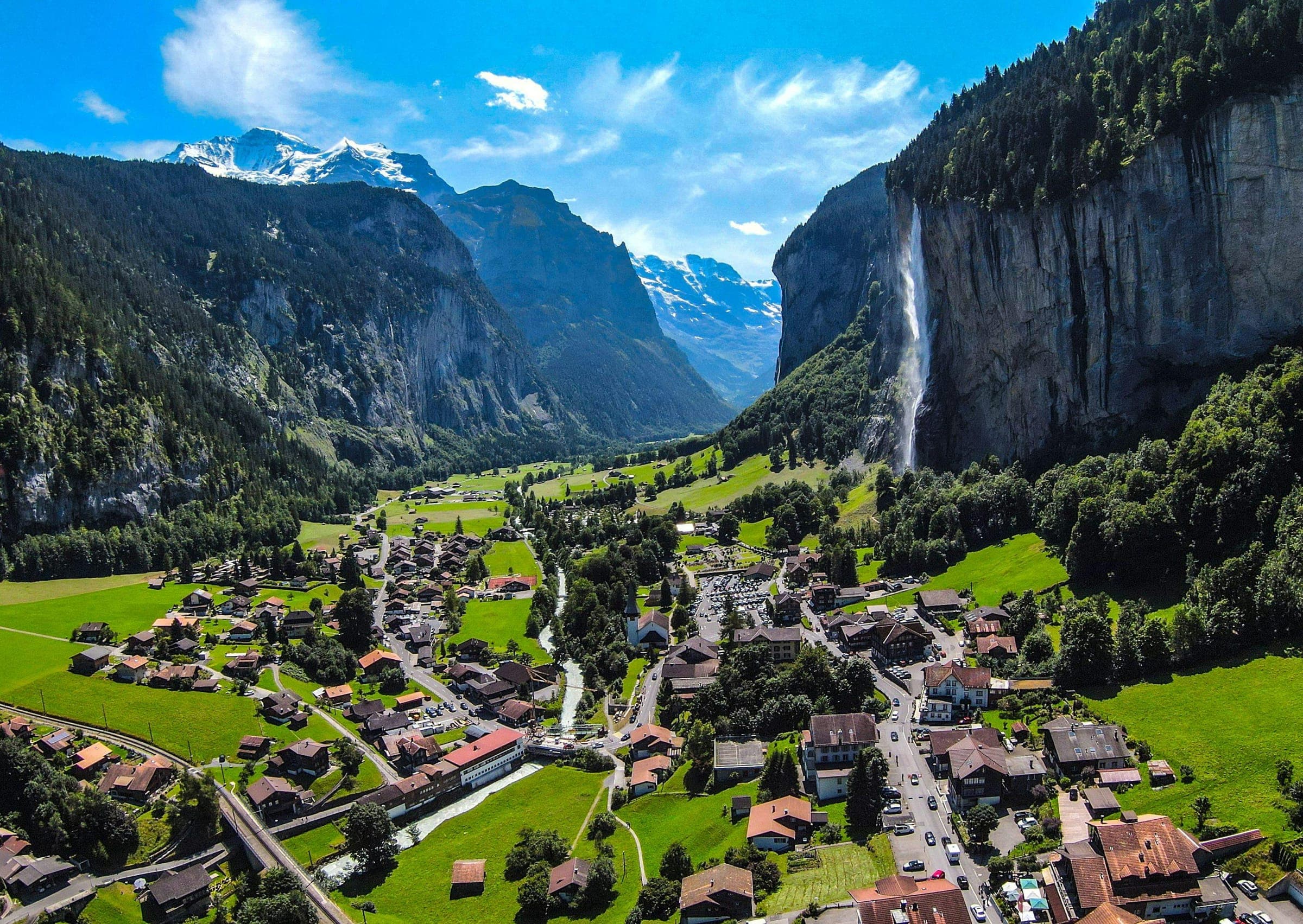The Lauterbrunnen Valley with cliffs and waterfalls, Mürren in the background.